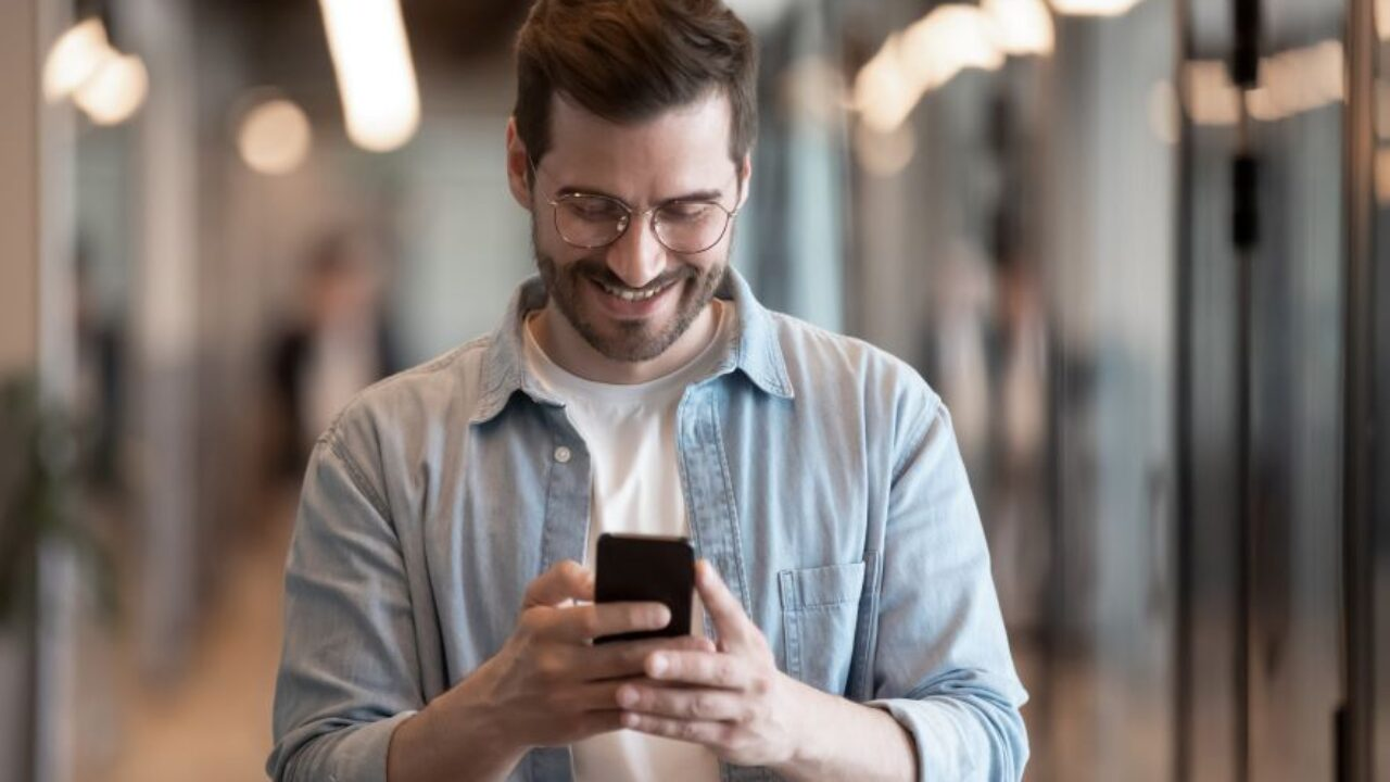 man smiling - How to Get More Views on Facebook Reels