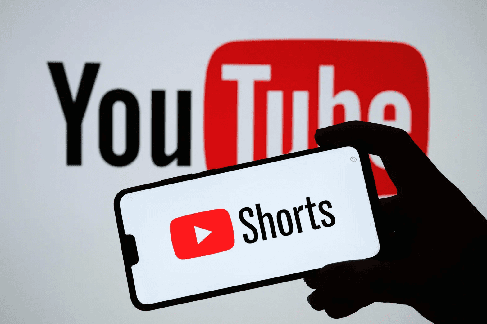Smartphone displaying YouTube Shorts logo -  YouTube Shorts Content Ideas